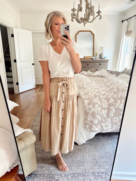 Summer outfit from Target! Love this skirt and the tie detailing on it. I paired it with a coordinating color V-neck shirt for a monochromatic look, which gives it a high-end feel! Wearing a size small in the skirt and a medium in the top, both are the tan color. 

#LTKTravel #LTKWorkwear #LTKOver40