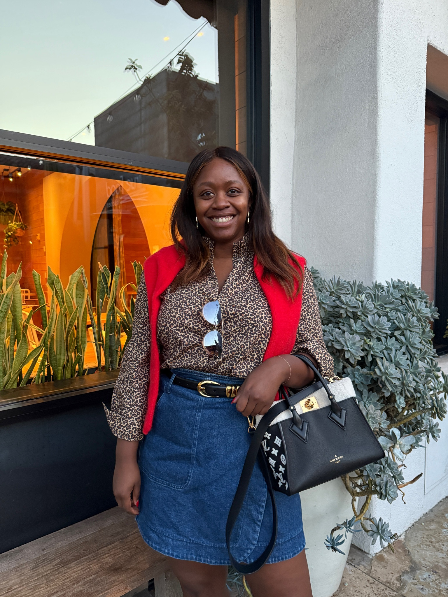 Leopard print blouse, denim mini skirt, and a pop of red! Wearing Sezane and Madewell  

#LTKStyleTip #LTKMidsize #LTKSeasonal