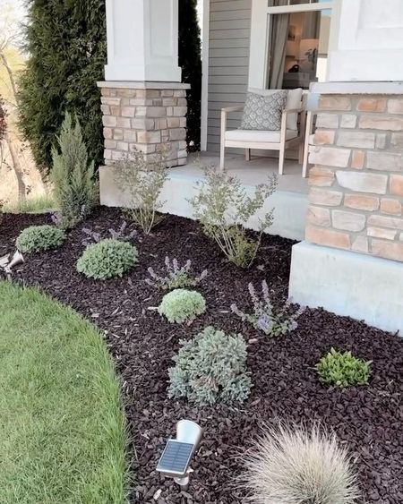 Linked the brown rubber mulch I love in our landscaping, the planters I have on the porch, our porch furniture, and outdoor rug. 

#LTKhome #LTKSeasonal