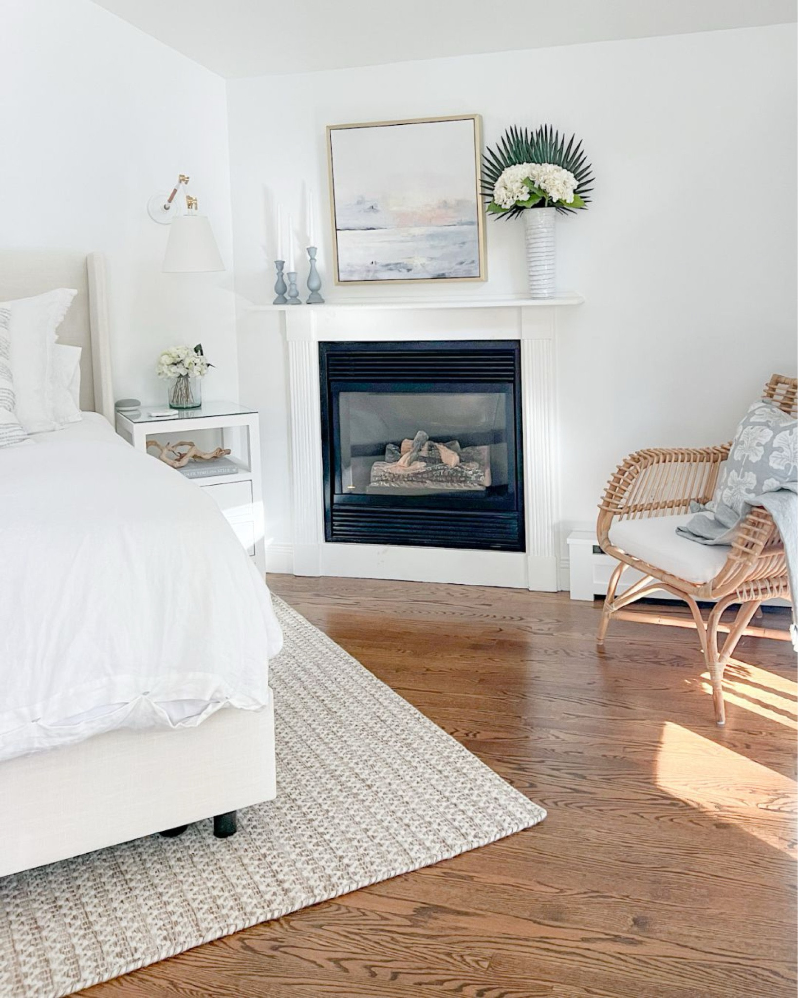 My bed, artwork and rattan chair are currently on sale, and I love the small-scale pattern in this neutral rug which creates the perfect amount of interest!
-
coastal home decor, coastal bedroom decor, coastal bedroom furniture, serena & lily pillow covers, white & blue pillow covers , beach house bedroom, beach house decor, beach house furniture, bedroom ideas, neutral bedroom decor, white nightstands, coastal nightstands, serena & lily wall sconces, rattan accent chair, coastal accent chair, bedroom seating, nightstand decor, white duvet cover, linen duvet cover, white bedding, coastal bedding, bedroom rugs, neutral rugs, 8x10 rugs, 9x12 rugs, coastal artwork, ballard designs art, white vases, spring flowers, palm stems, mantel decor, Euro shams, linen bedding, upholstered bed, tilly bed, wayfair bed

#LTKsalealert #LTKhome #LTKstyletip