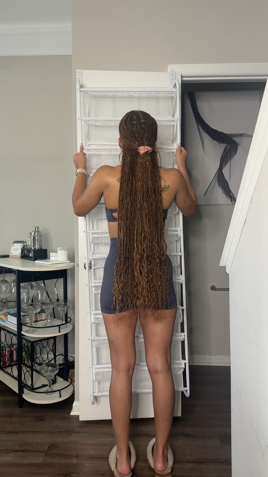 This over-the-door shoe organizer keeps your kicks secure (mesh back = no falling shoes), protects your door, and can even be wall-mounted. Small space, big storage win 🖤