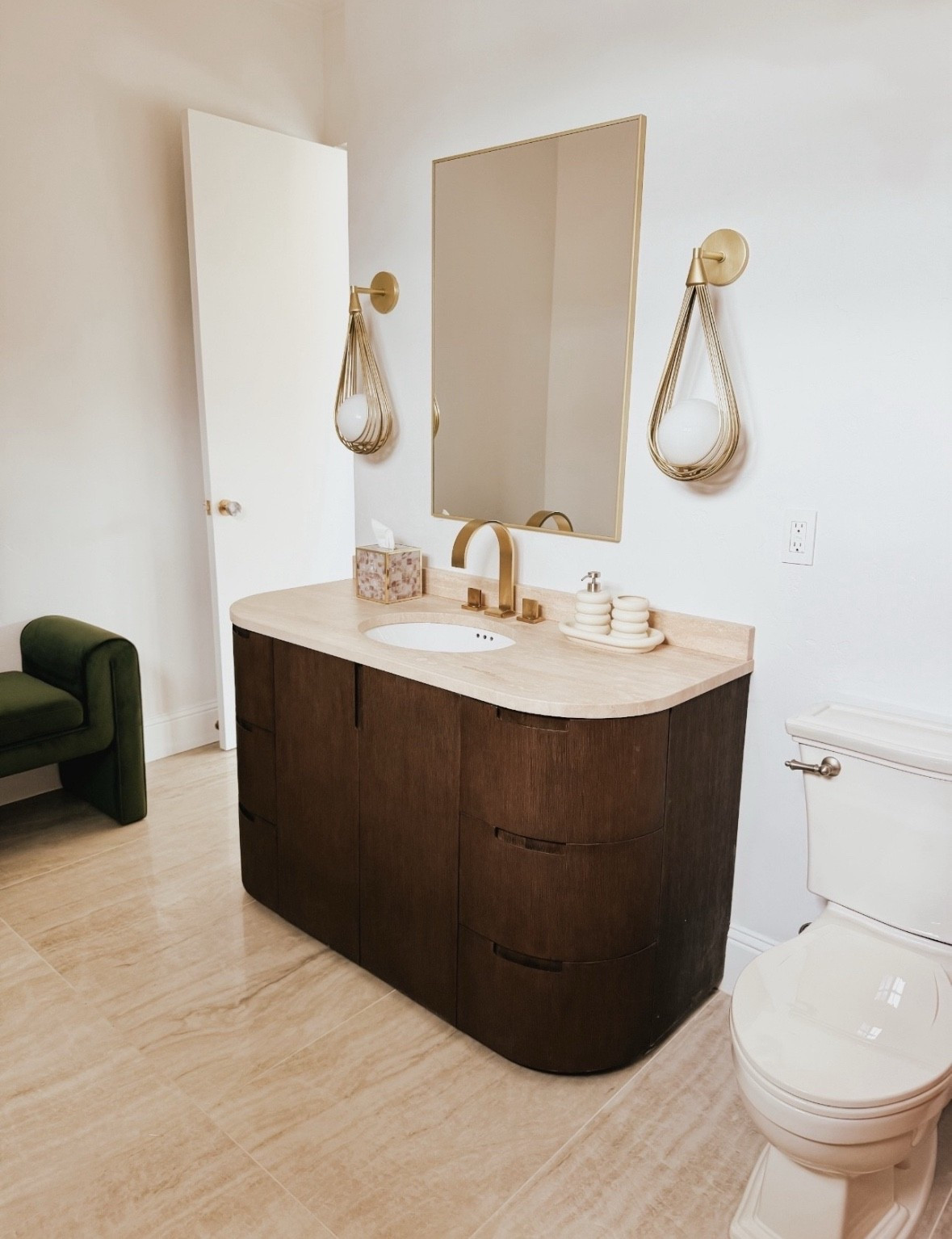 This guest bathroom is so unique with the tear drop sconces and gold faucet finishes with a pop of green in the bench 



#LTKU #LTKHome