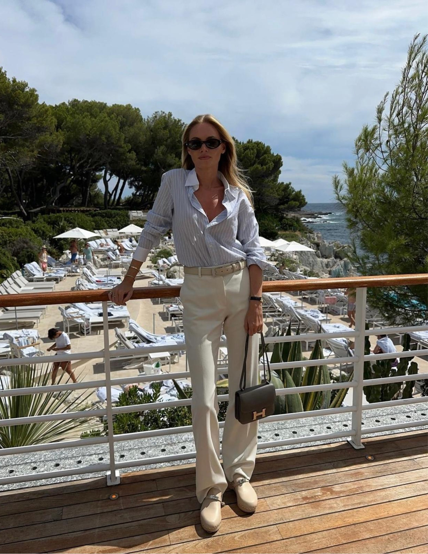 Pinstripe button down, cream tailored trousers, Hermes mules, Hermes Constance handbag 

#LTKSeasonal #LTKStyleTip #LTKItBag