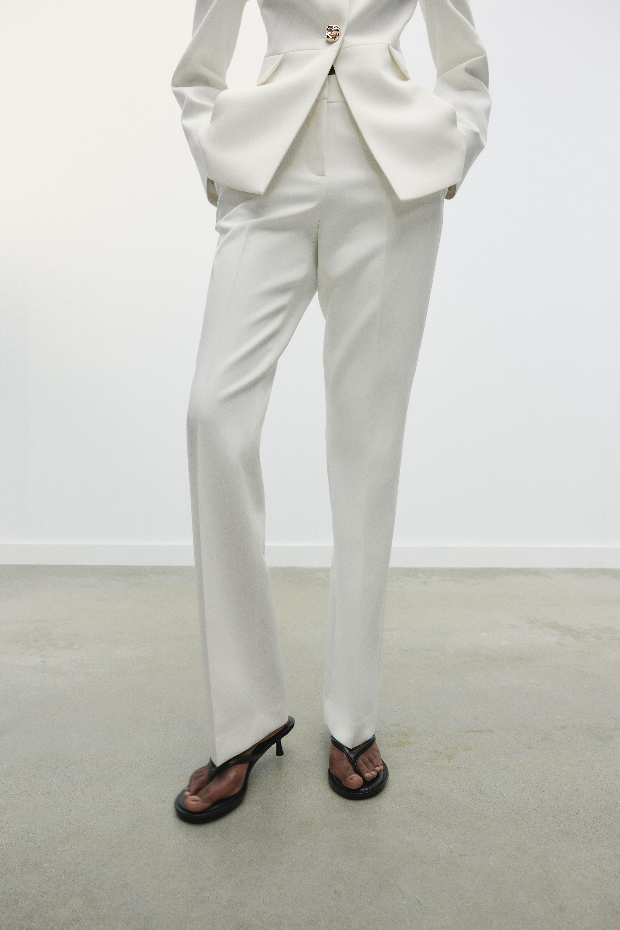 High-waisted pants with front pockets and back false welt pockets. Straight leg. Front zip, insid... | Zara US