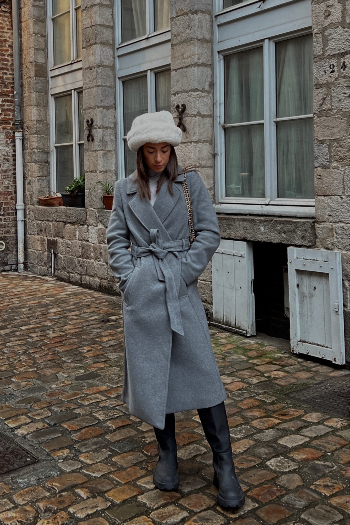 Winter outfit. Winter look. Winter style. Grey wrap peacoat. Cream fluffy hat. Cold weather accessories. What to wear in France. Black rubber boots. Wellies. Rain boots. 

#LTKSeasonal #LTKeurope #LTKsalealert