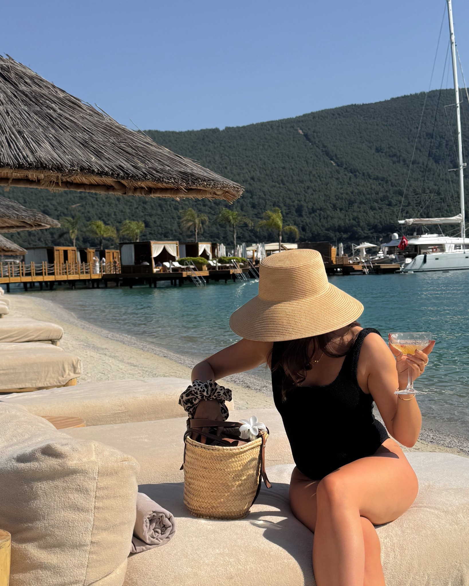Beach ready in a black crinkle swimsuit and wide brim gorgeous sun hat - what a vibe!? 

My Loewe classic basket comes everywhere with me, an essential for trips! 

#LTKuk #LTKAroundTheWorld #LTKsummer