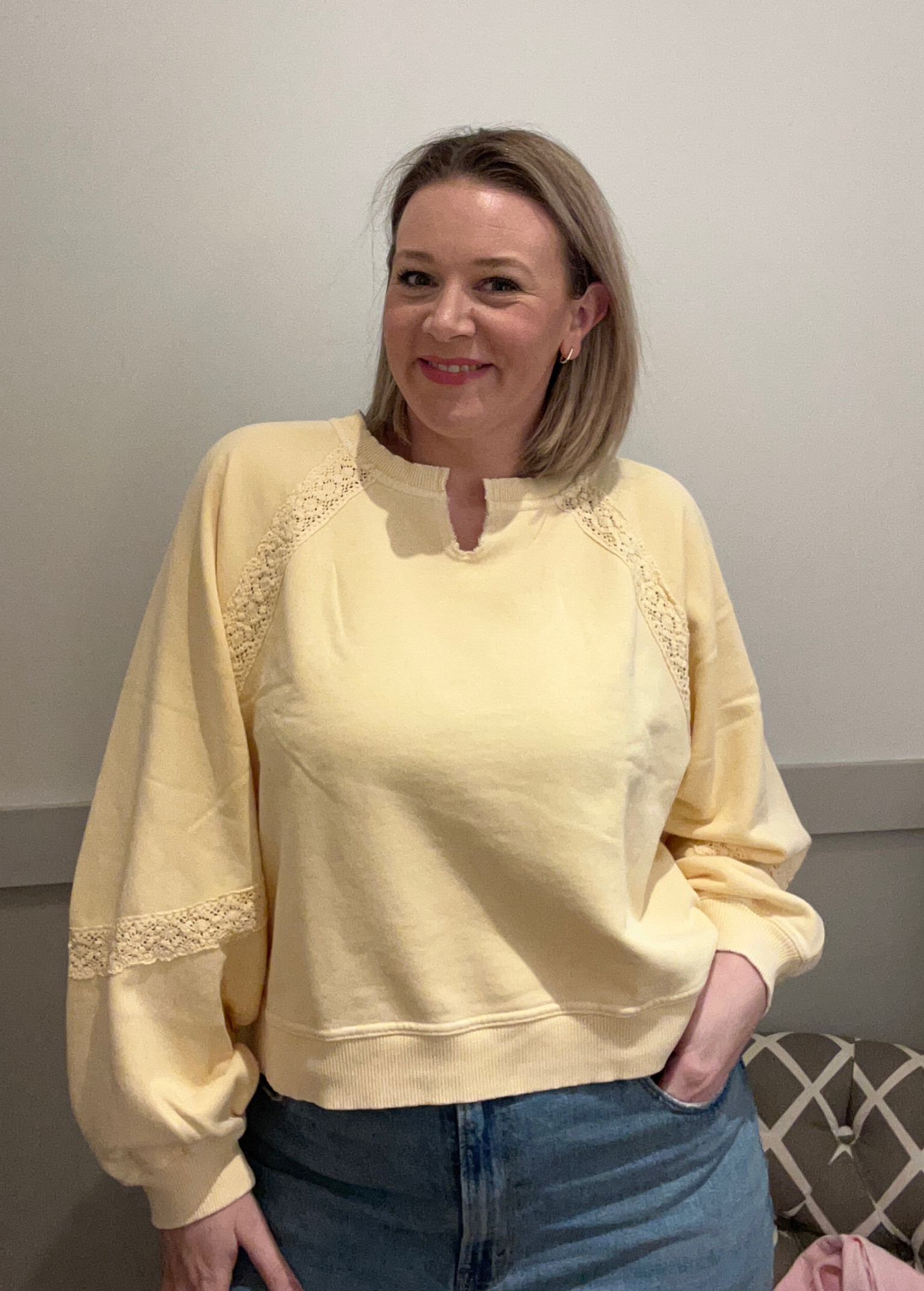 I absolutely love the color of this top. It is such a beautiful buttery yellow. The lace detail is the perfect addition.