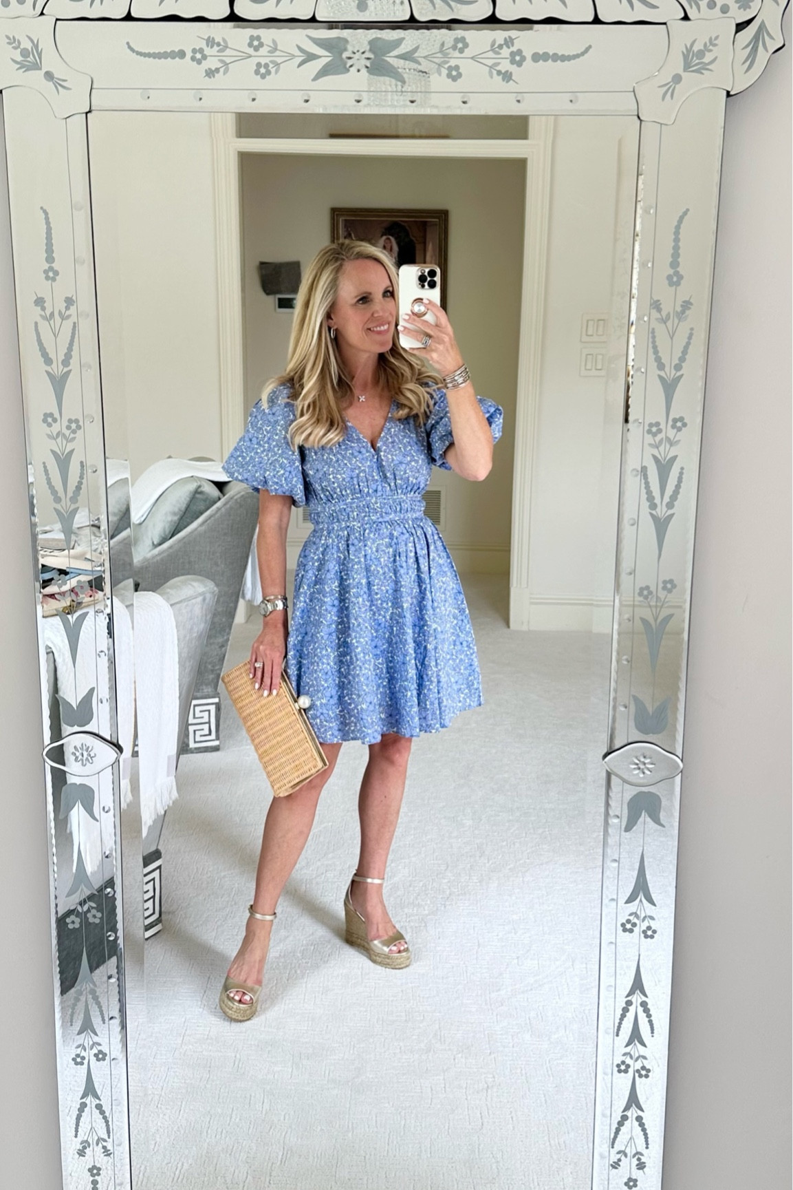 Blue and white floral mini
Puff sleeve 
Waist cinching detail 
Runs a tad small this is size S
Champagne gold Stuart Weitzman espadrilles 
Pamela Munson Wicker clutch 

#LTKshoecrush #LTKunder100 #LTKSeasonal