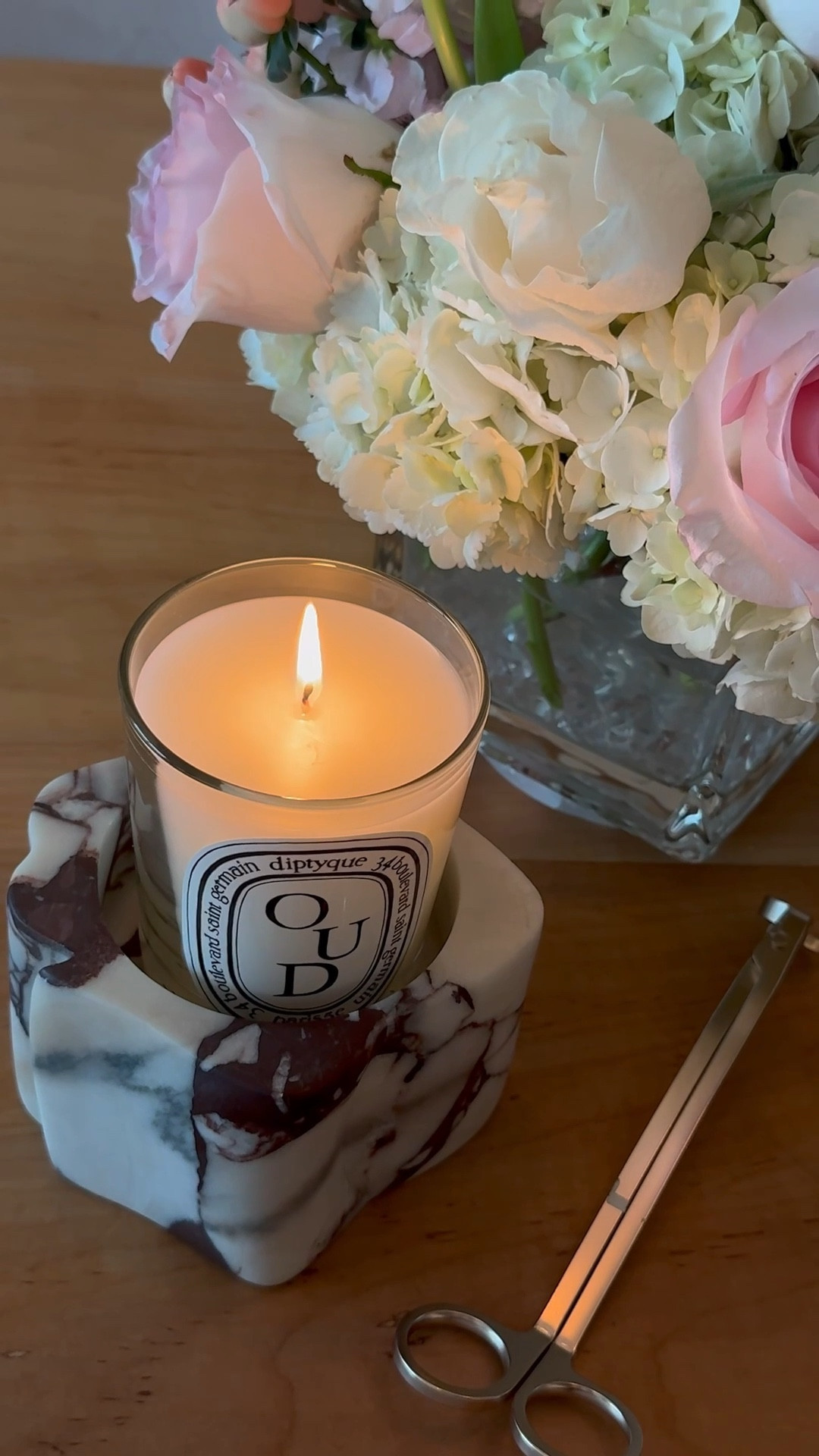 A quiet little moment that feels like pure indulgence. My favorite Diptyque OUD candle glowing on a marble holder, fresh flowers softening the scene, and a glass of champagne to end the day on a high note. It’s the simple luxuries that make a space feel layered, intimate, and alive.

#LTKselfcare #LTKGiftGuide #LTKHome