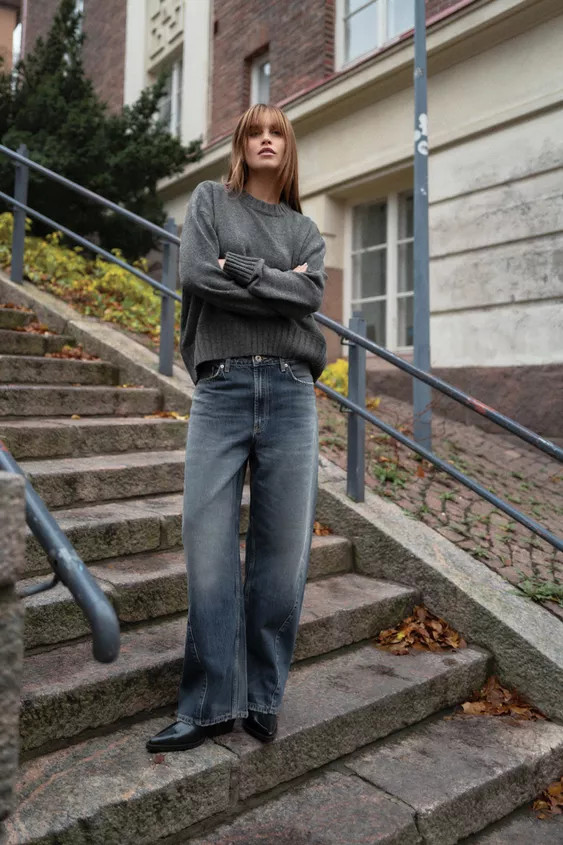 Round neck long sleeve sweater. Wide tonal ribbed trim. Asymmetrical hem. | Zara US