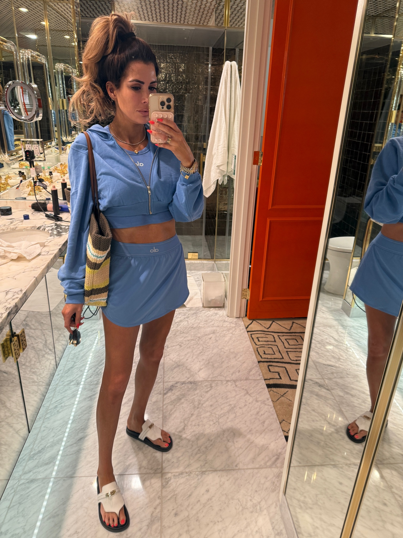 Wearing size small in skort, tank, and jacket 