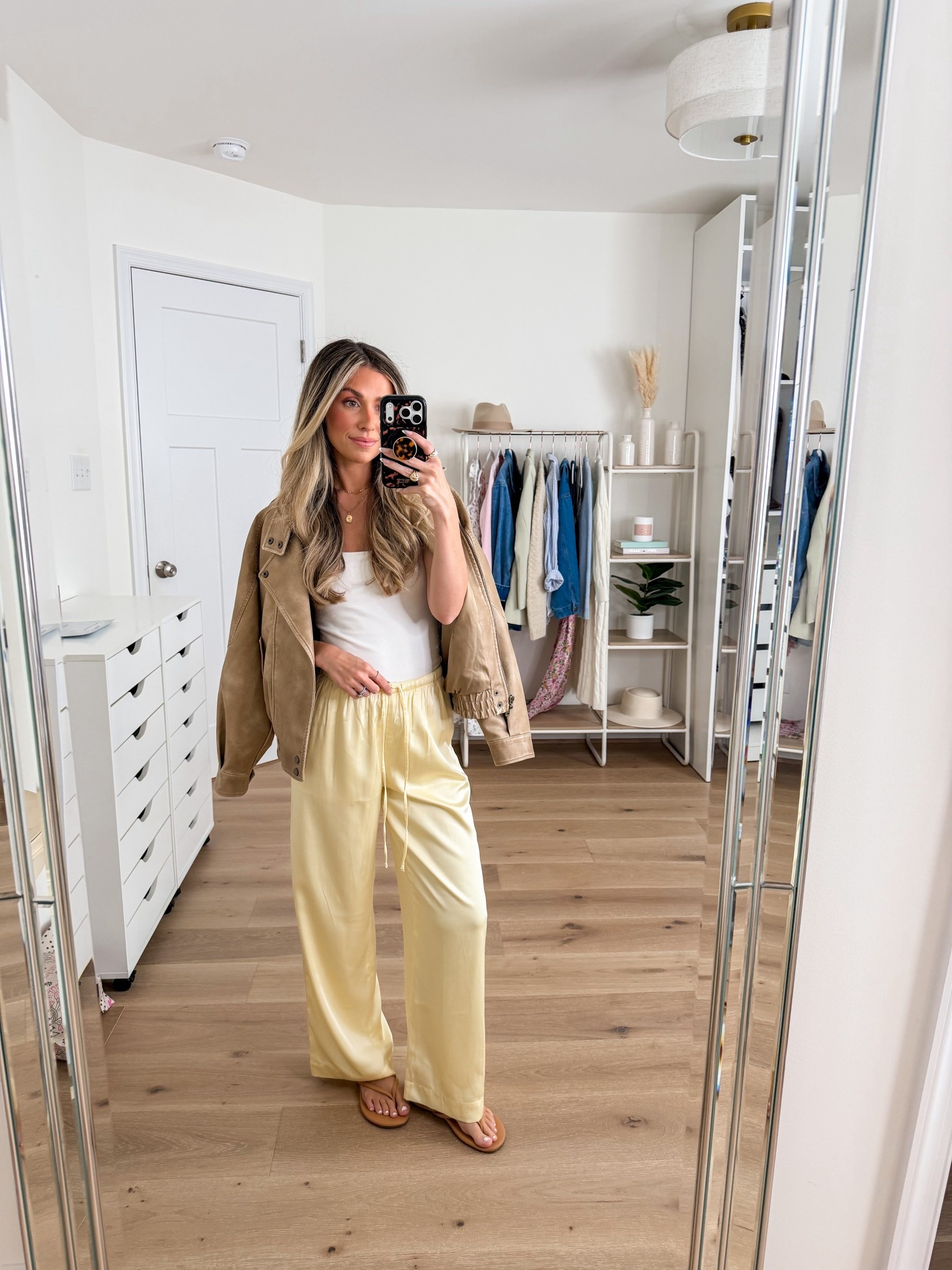 Elevated casual spring outfit — all on sale! 
+ moto jacket: xxs — oversized fit 
+ 90s bra free cami: xs
+ yellow satin pants: xxs petite 

#LTKSaleAlert #LTKSpringSale #LTKootd
