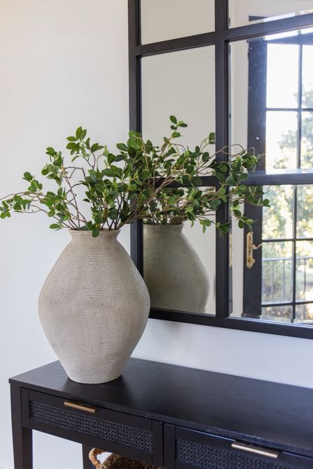 Loving this vase stem combo in the black console table! 