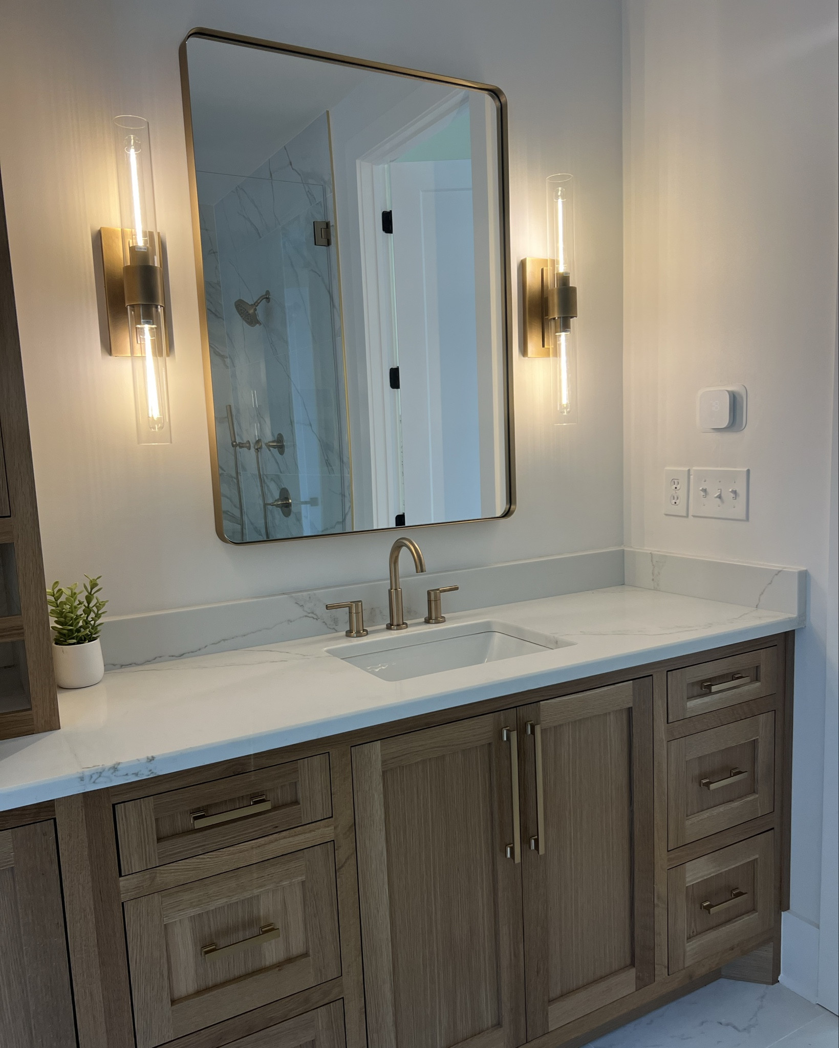 Love how these sconces & hardware turned out in our Master Bathroom. The sconces give off a relaxing, moody feel. We used the color champagne bronze for hardware. #masterbathroom #sconces #bathroomhardware #bathroomsconces #masterbathdecor #goldhardware #bathroommakeover #amazonfinds

#LTKHome