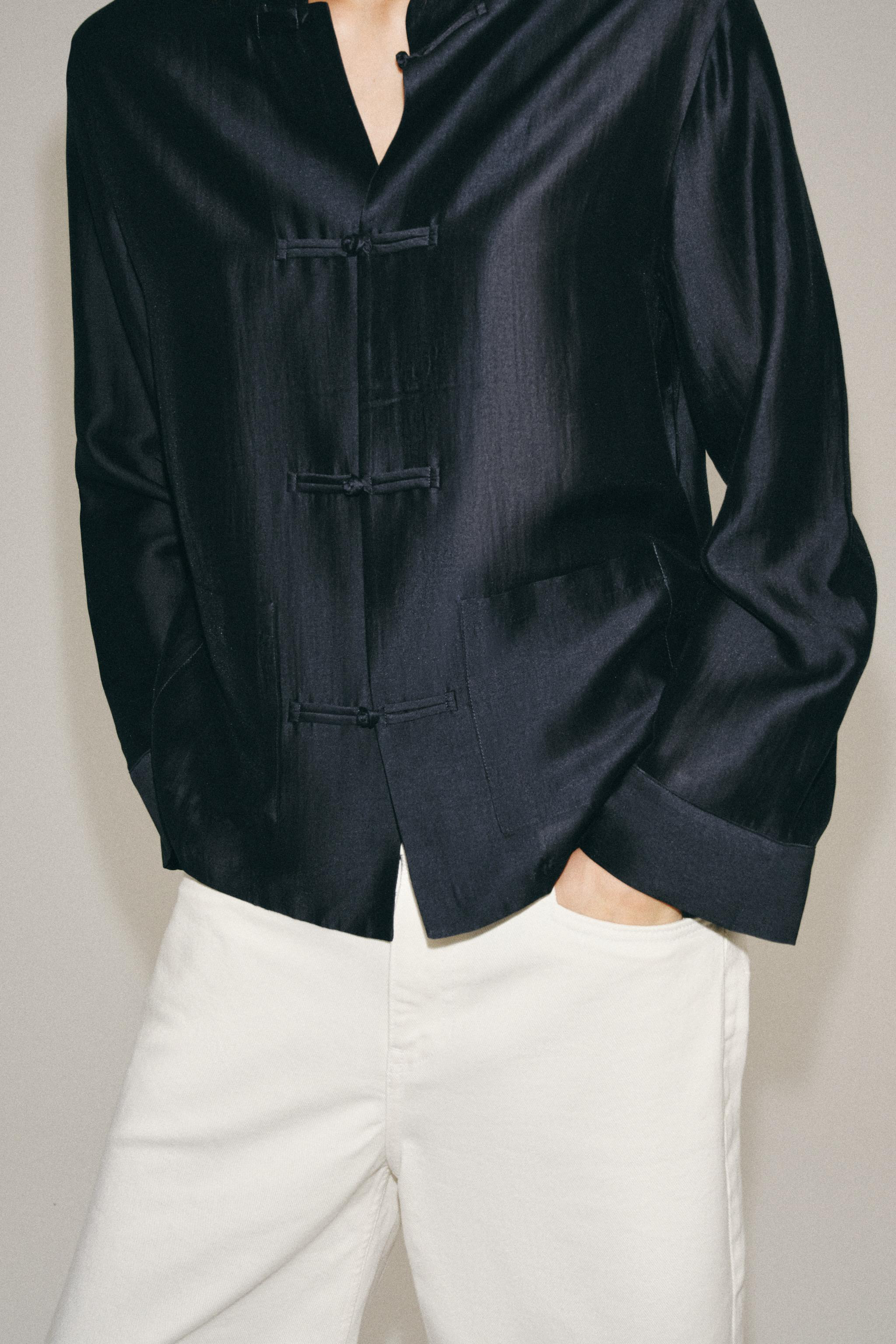 ZARA WOMAN COLLECTIONShirt made from a lyocell blend yarn. Round neck and long sleeves with cuffs... | Zara US