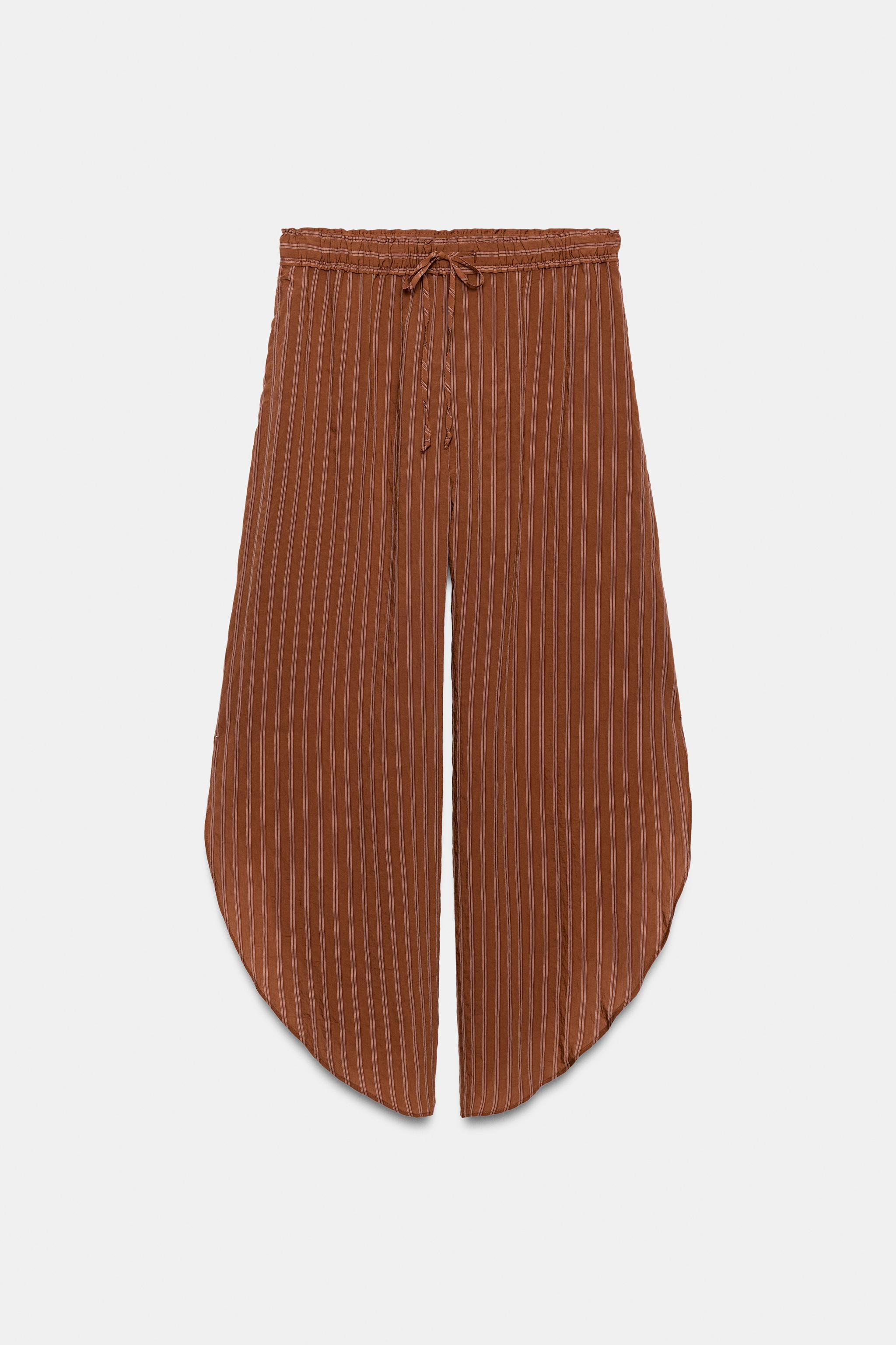 ZARA WOMAN COLLECTIONTrousers made from a viscose blend yarn. Mid-rise with an elasticated drawst... | Zara US