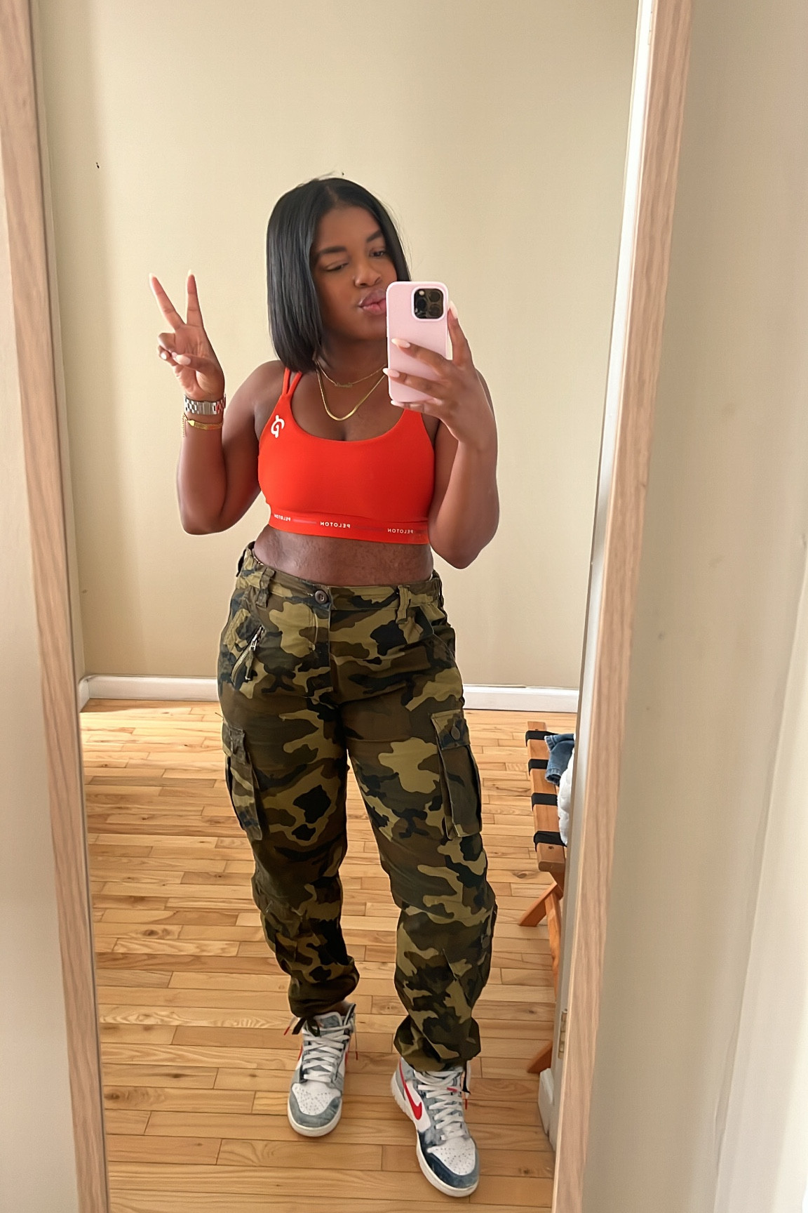 Wearing a 10 in the pants and medium in the top .  Sneakers are TTS