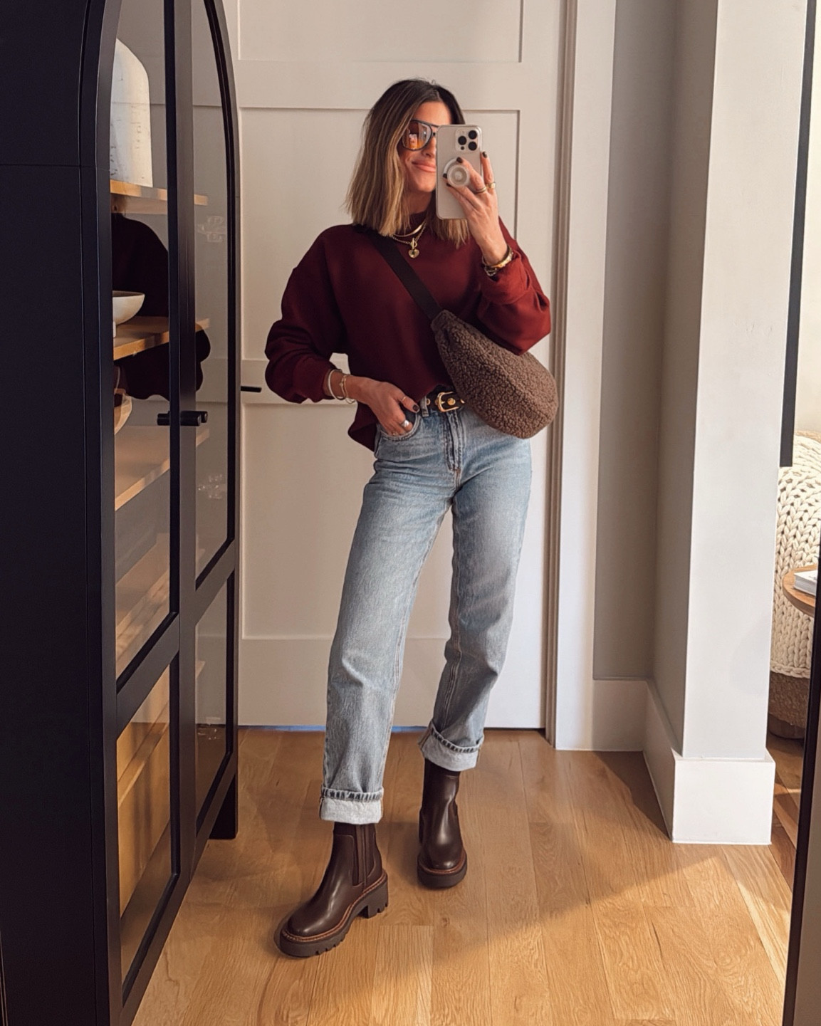 An easy way to style any oversized sweatshirt! I LOVE this $12 one and have it in several colors, I sized up to a medium for an oversized fit, but your true size is best for tucking in! Jeans are true to size and I’m in the regular length, and my exact boots are old and sold out, so I linked two very similar options! 

#LTKStyleTip #LTKFindsUnder50 #LTKFindsUnder100