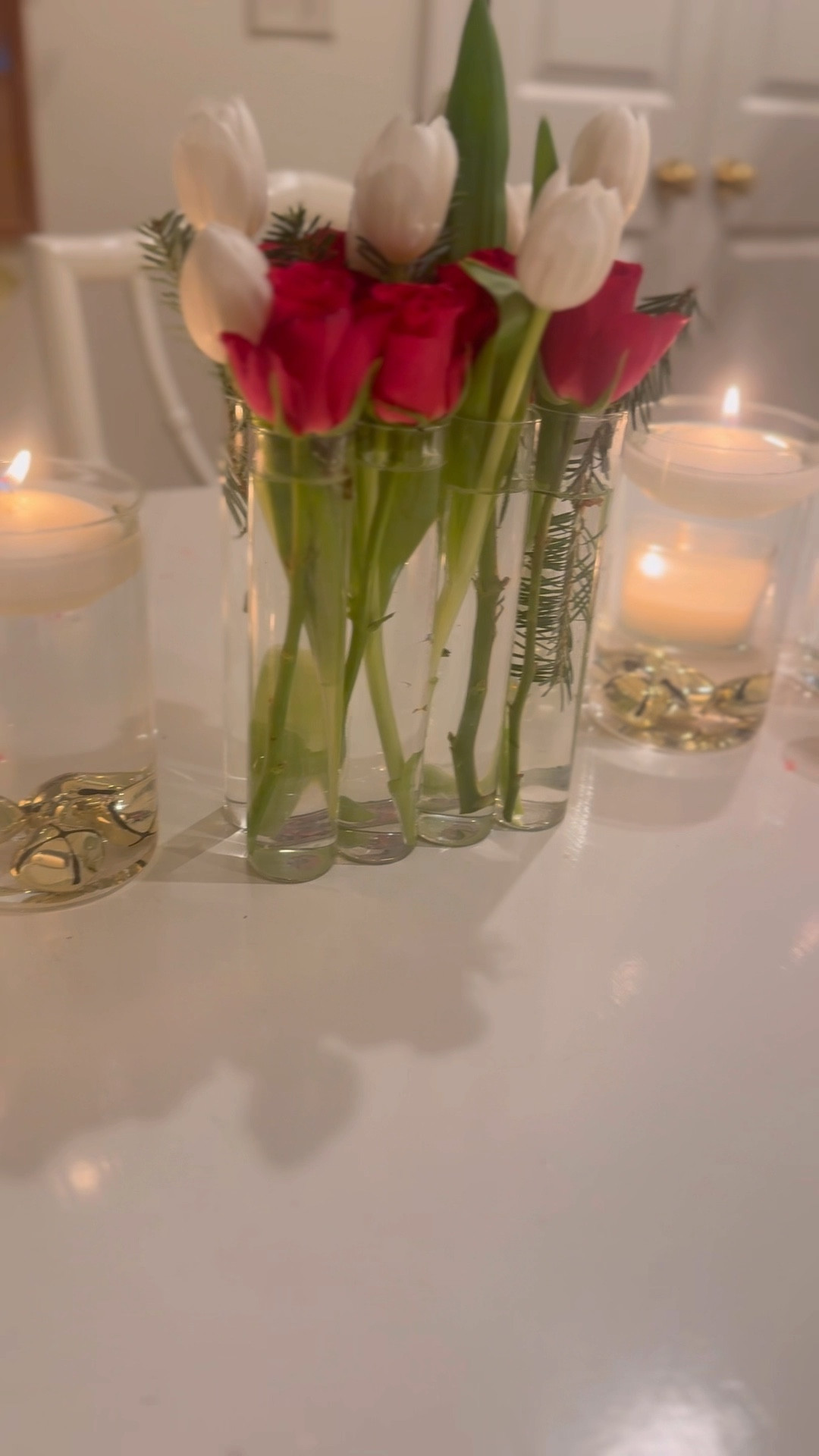 really cute and affordable table decor! glass votives with floating candles & gold jingle bells at bottom❤️ and i love my test tube vases!! they are just so easy you stick in flowers and can not mess up! 

#LTKParties #LTKSeasonal #LTKHoliday