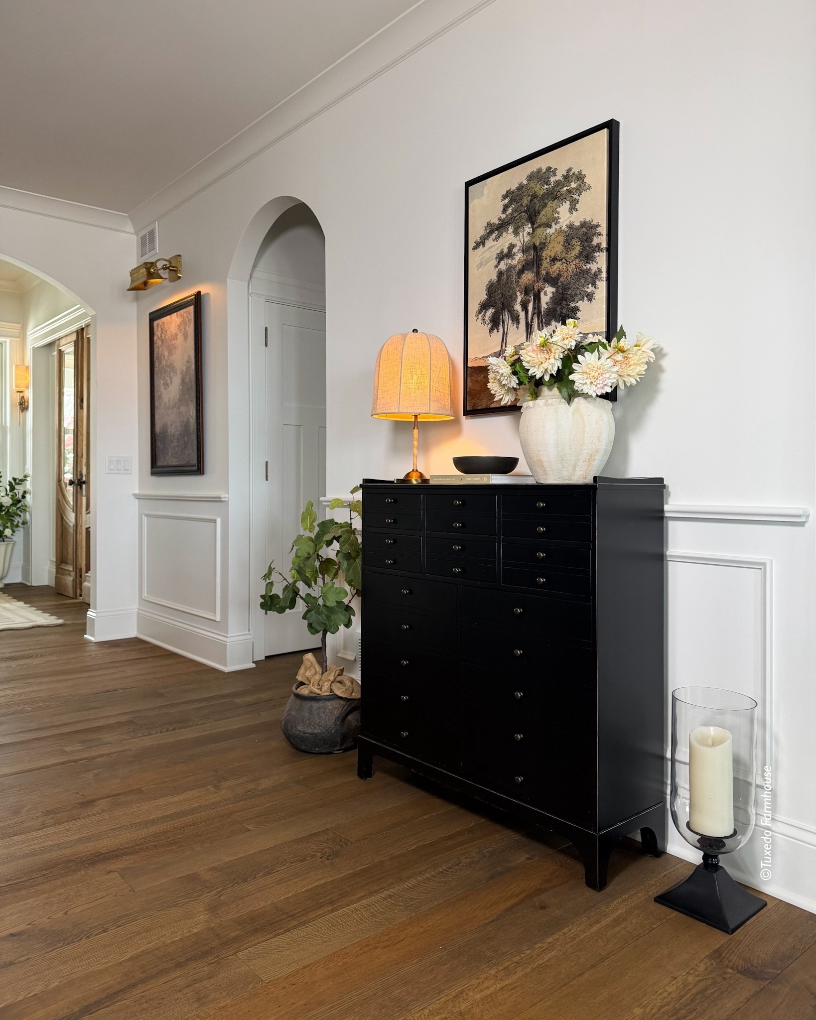 Spring in the hallway entry to my great room with new art and a spring bouquet. This apothecary cabinet is still a fav piece of mine and is on sale  

#LTKSaleAlert #LTKHome #LTKSeasonal