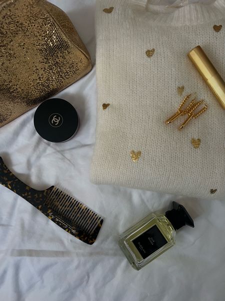 Chanel bronzer, sezane jumper, cuir beluga, Guerlain perfume, gold clutch, link earrings, missoma earrings 

#LTKbeauty #LTKeurope
