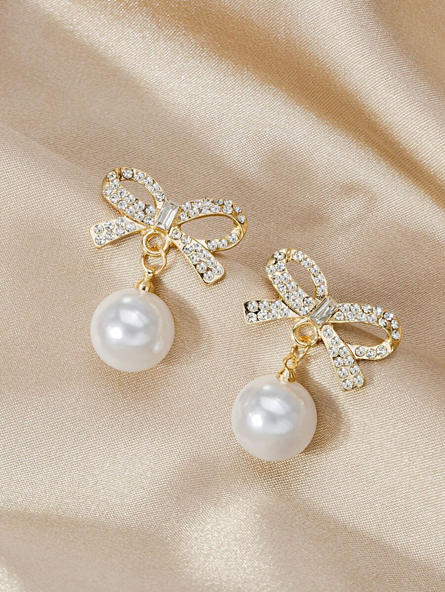 Rhinestone Bow Decor Faux Pearl Drop Earrings SKU: sj2201195908519630(47 Reviews)$2.00Make 4 paym... | SHEIN