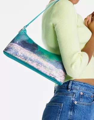 ASOS DESIGN shoulder bag with hardware tabs in satin scenic print | ASOS (Global)