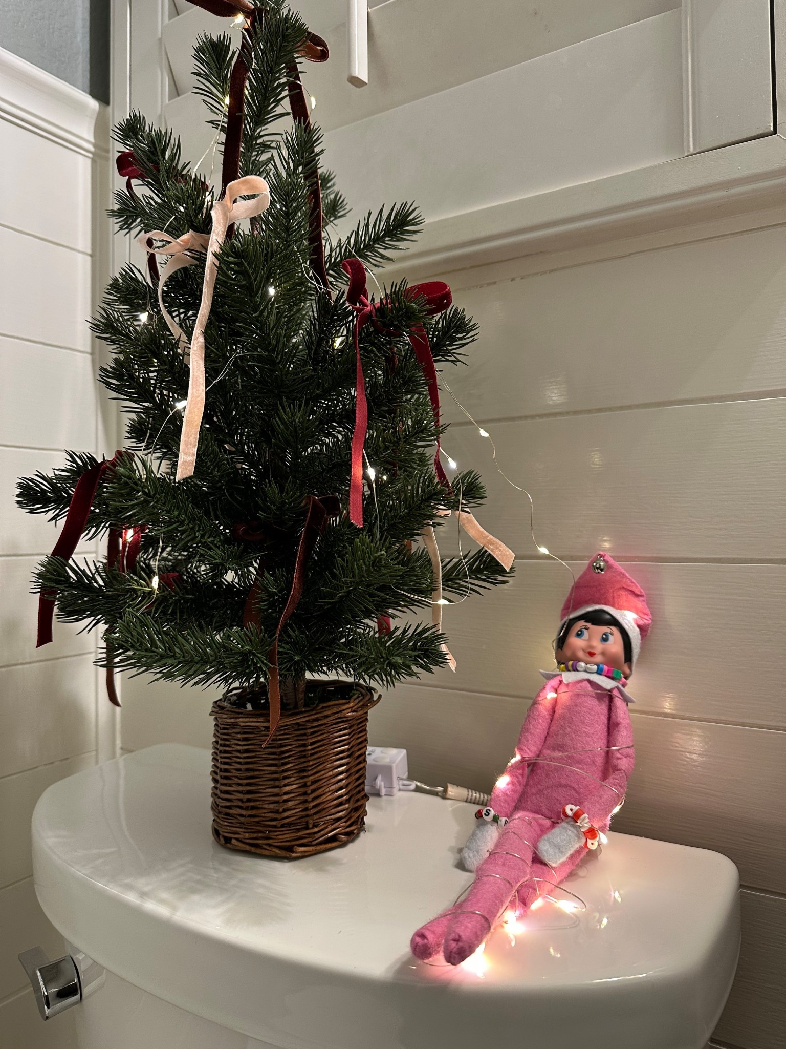 Mini christmas tree decorated with fairy lights and thin velvet bows

#LTKHoliday #LTKHome