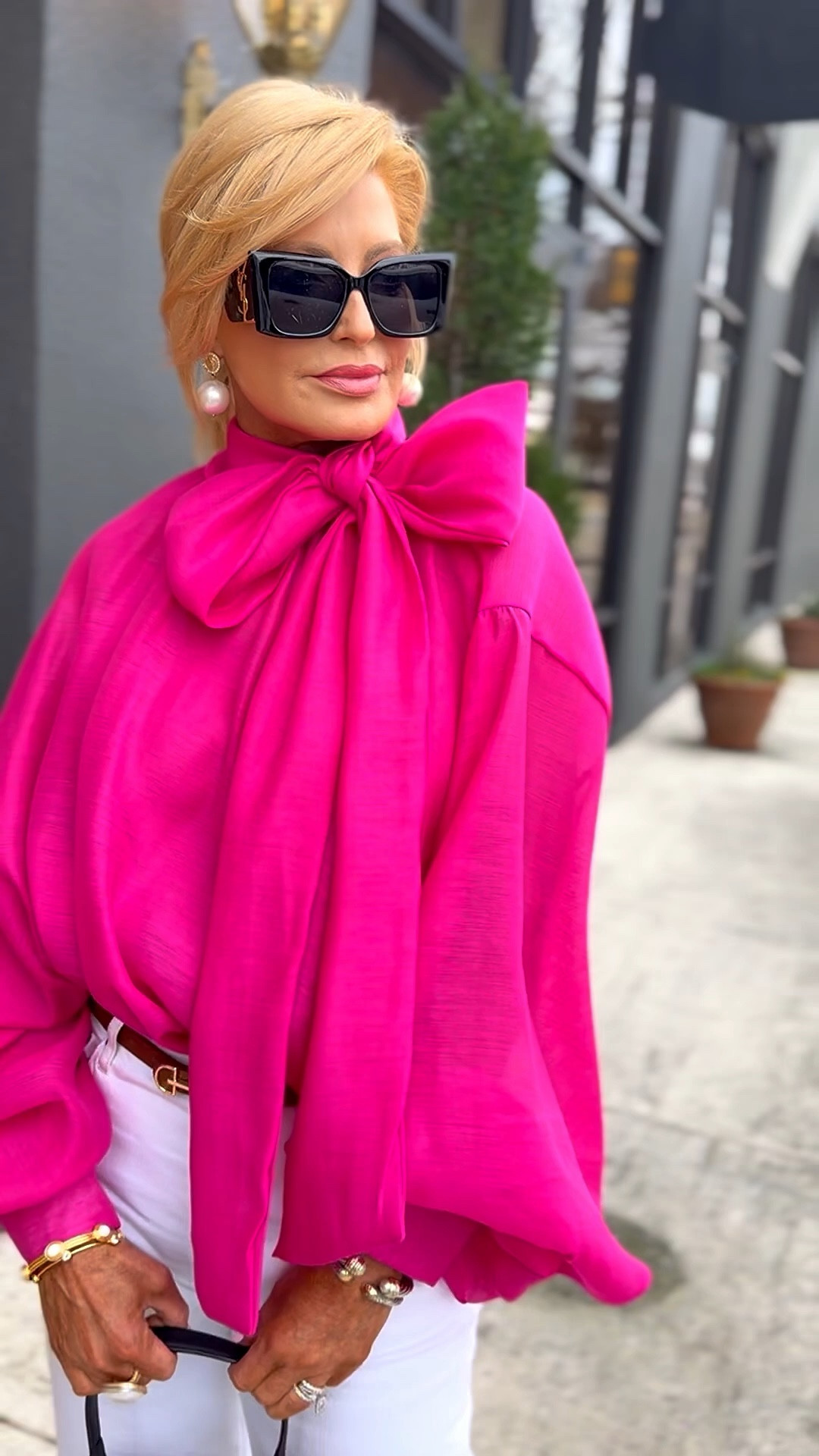 This top looks & feels exactly like the designer version but in hot pink!! It’s one size & fits a wide range of sizes because of its beautiful design.  I’m wearing a 27 in my jeans  

#LTKvlog #LTKdayinmylife #LTKTravel