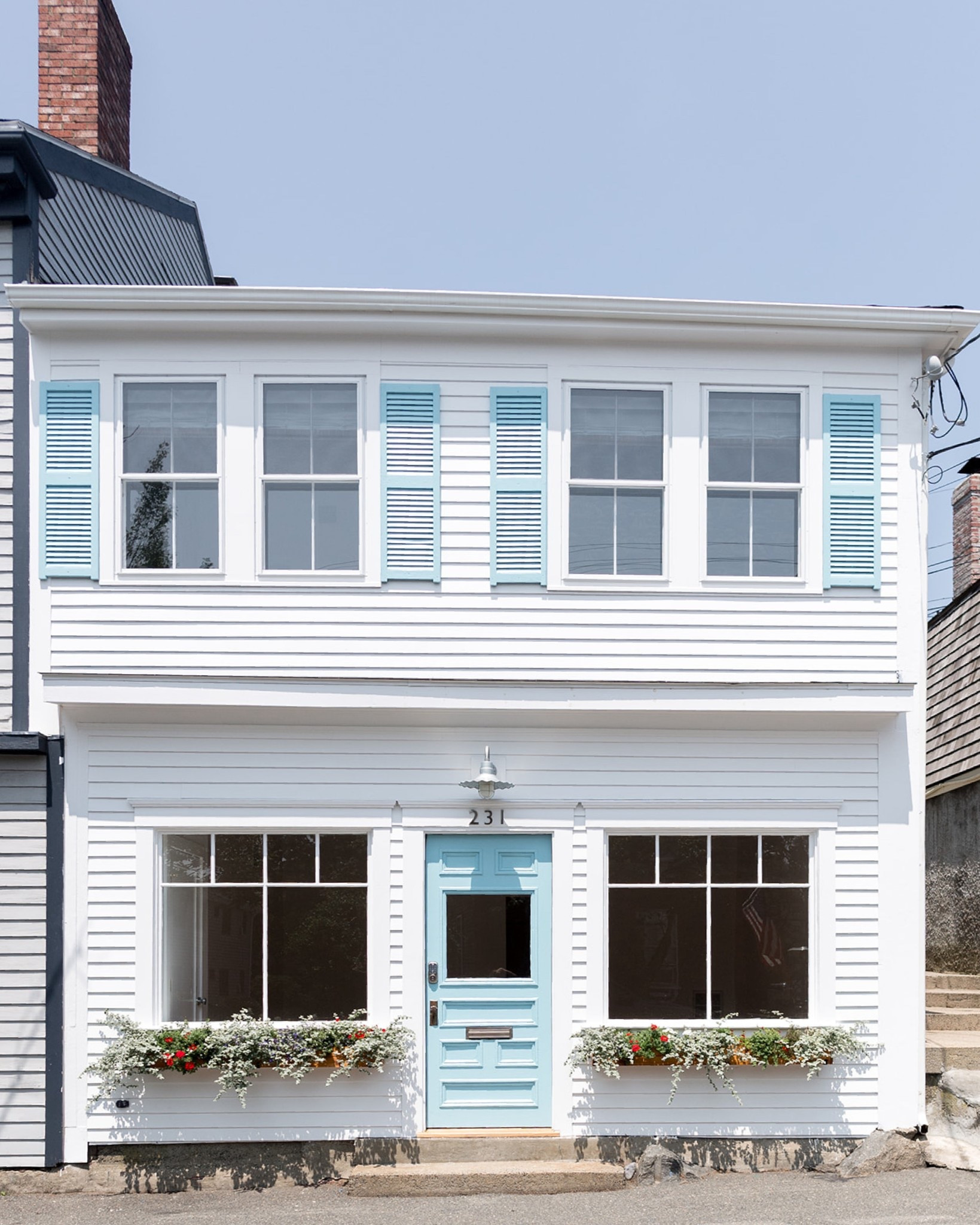 today we’re sharing the exterior transformation of the #mixedusemini! when we first purchased the property, it had been vacant for some time and was in need of serious TLC. in addition to new windows, we painted the exterior white for a fresh, clean look and selected a bold turquoise for the shutters and doors, aiming to create a summery, welcoming feeling. natural wood window boxes and a galvanized metal gooseneck sconce add curb appeal and help designate the first floor as a retail space, while the second floor serves as a #dwelloctoberstay short term rental unit perfect for a coastal getaway. #dwelloctober 

#LTKHome