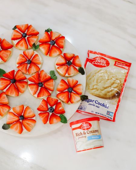 FRUITY & FLORAL MINI SUGAR COOKIE PIZZAS #ad

These strawberry sugar cookies take me back in time to when I was a little girl! My Grandma Betty and I would spend summers on her Iowa farm baking cookies, pies, and endless amounts of desserts. I remember vividly riding in her van down windy country roads to make a trip to her local @Target and stocking up on @BettyCrocker supplies to prep for a summer full of creating magical treats and memories! She had such a knack for elevating the simplest of recipes just like this one! If you’re looking for a quick, simple, and delicious spring recipe, try this one taste tested and approved by my Grandma Betty herself! #TargetPartner #BettyCrocker #Target

INGREDIENTS:

- Betty Crocker Sugar Cookie Mix
- Betty Crocker Rich & Creamy 
- Vanilla Frosting 
- 1 Stick of Softened Butter
- 1 Egg
- Strawberries
- Blueberries
- Mint for garnish

DIRECTIONS:

Preheat oven to 350 degrees. Mix egg, softened butter and Betty Crocker Sugar Cookie Mix until dough ball forms. Scoop one inch dough balls and place on baking sheet 2 inches apart. Bake for 10-15 minutes until the edges are lightly golden brown. Let cool and slice strawberries thinly. Frost cooled cookies with Betty Crocker Vanilla Frosting. Top with Strawberries, Blueberries and a optional sprig of mint to garnish!

Click the link in my bio to shop OR shop these items on my liketoknow.it/fivefootfeminine! 

#LTKSeasonal #LTKhome #LTKparties