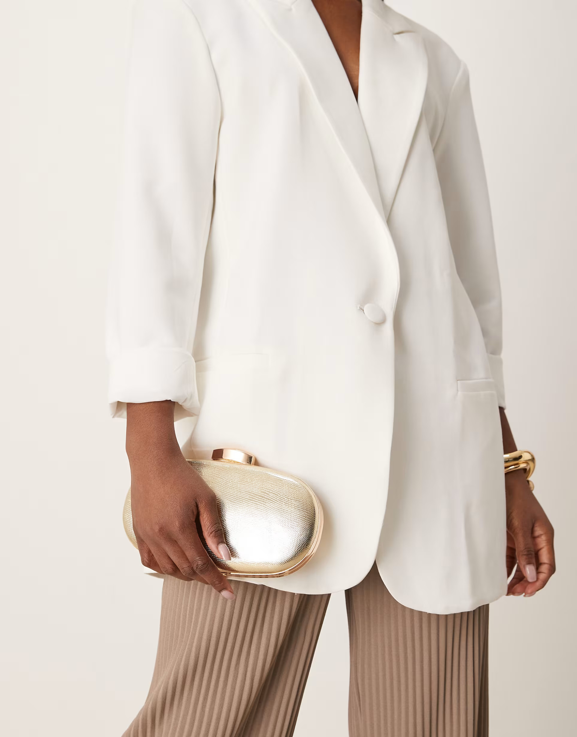 True Decadence textured metallic clutch bag in gold | ASOS (Global)