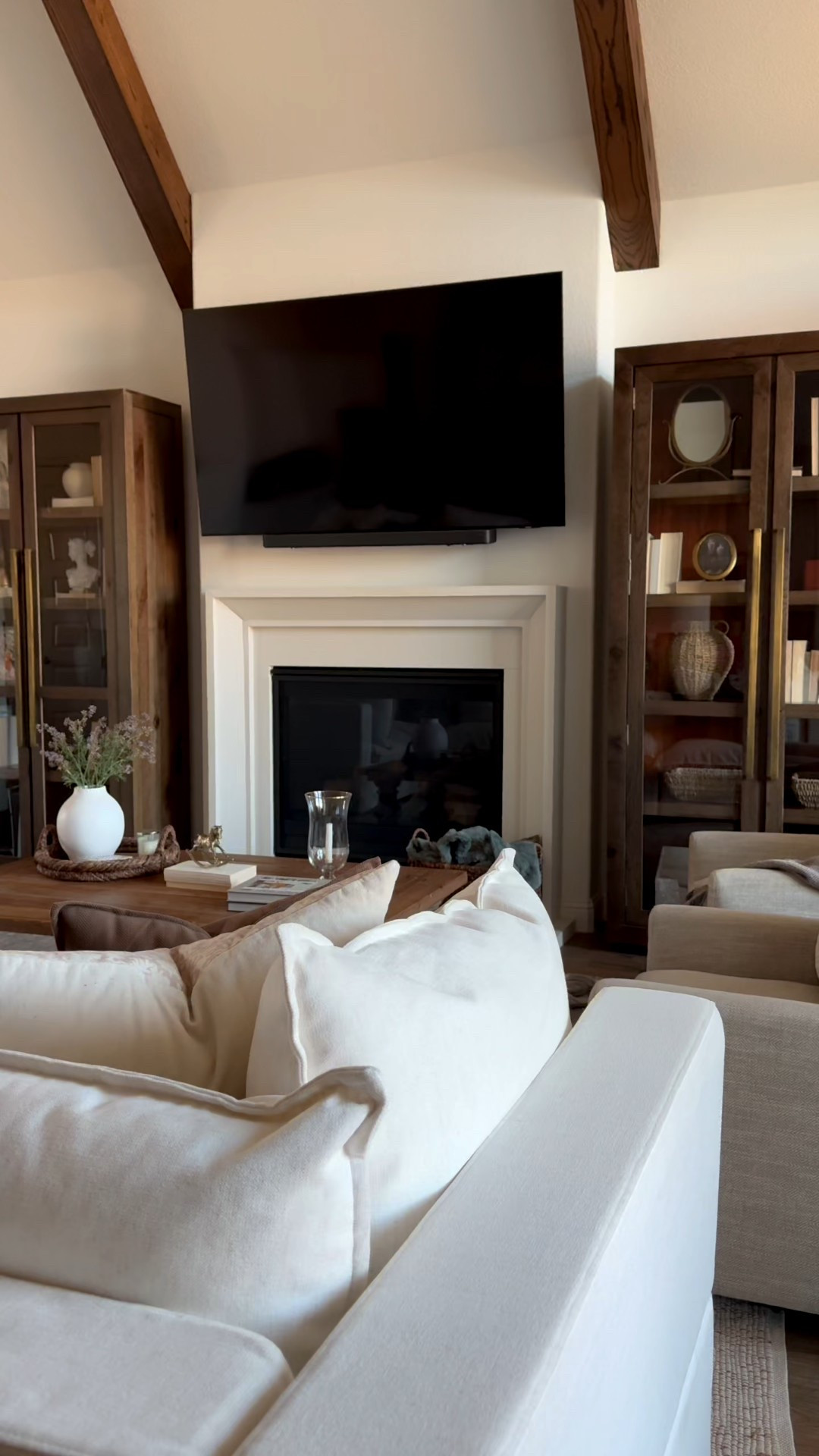 Living room design, home inspo, tall wood cabinets, coffee table, sectional, bedroom, cozy bedroom, door hardware, home design, open concept, modern farmhouse, wood shelves, outdoor playset, year 2025, new year

#LTKvlog #LTKdayinmylife #LTKHome