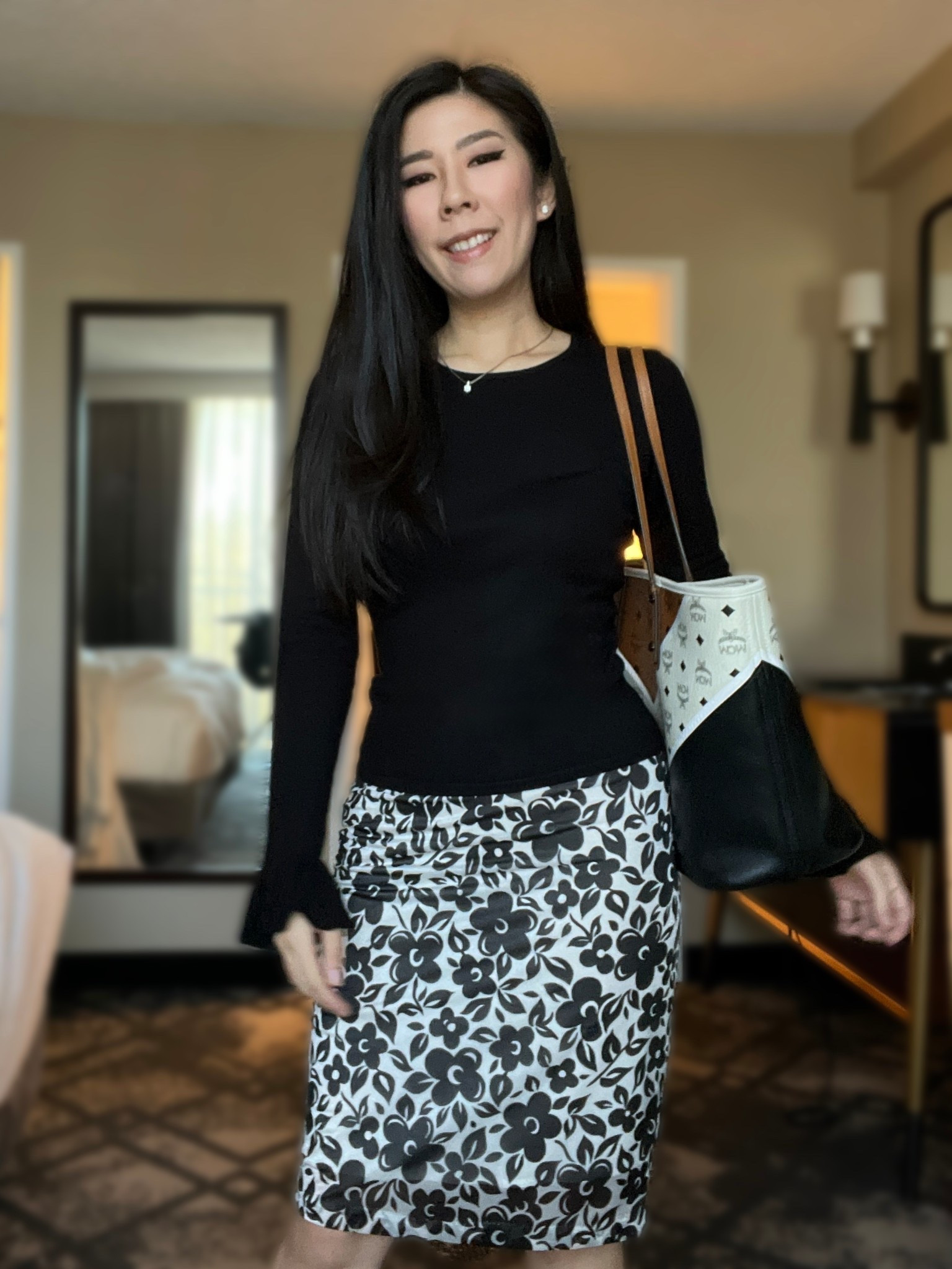 My typical outfit formula when I have nothing to wear for work is a pencil skirt and top combination. This pencil skirt feels silky smooth on and has a black floral pattern on it. To keep it minimal, I paired it with a black long sleeve flare cuff top. 

#businesscasual #corporatestyle #9to5style #pencilskirt #flowerskirt #flaresleevetop #modeststyle #workwear #oldmoney 

#LTKootd #LTKPetite #LTKWorkwear