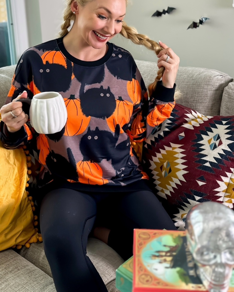 Purple sweatshirt with black cats and pumpkins for fall. Comfortable, inexpensive, and perfect for Halloween spooky style 

#LTKFamily #LTKSeasonal #LTKFindsUnder50