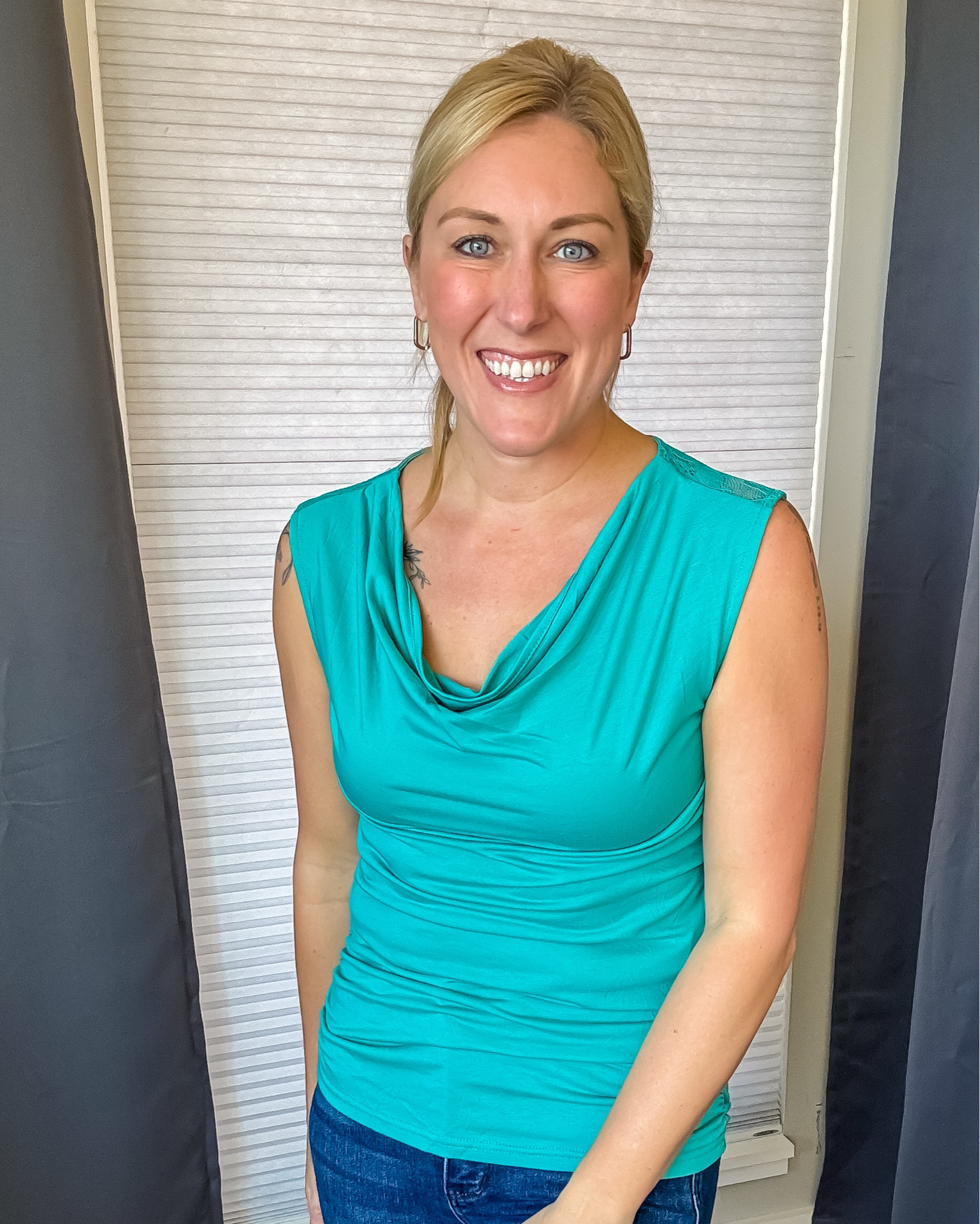 The cowl neck and lace back on this sleeveless top make it so feminine! The fabric is ultra soft and stretchy… plenty of ruching in the tummy area! 