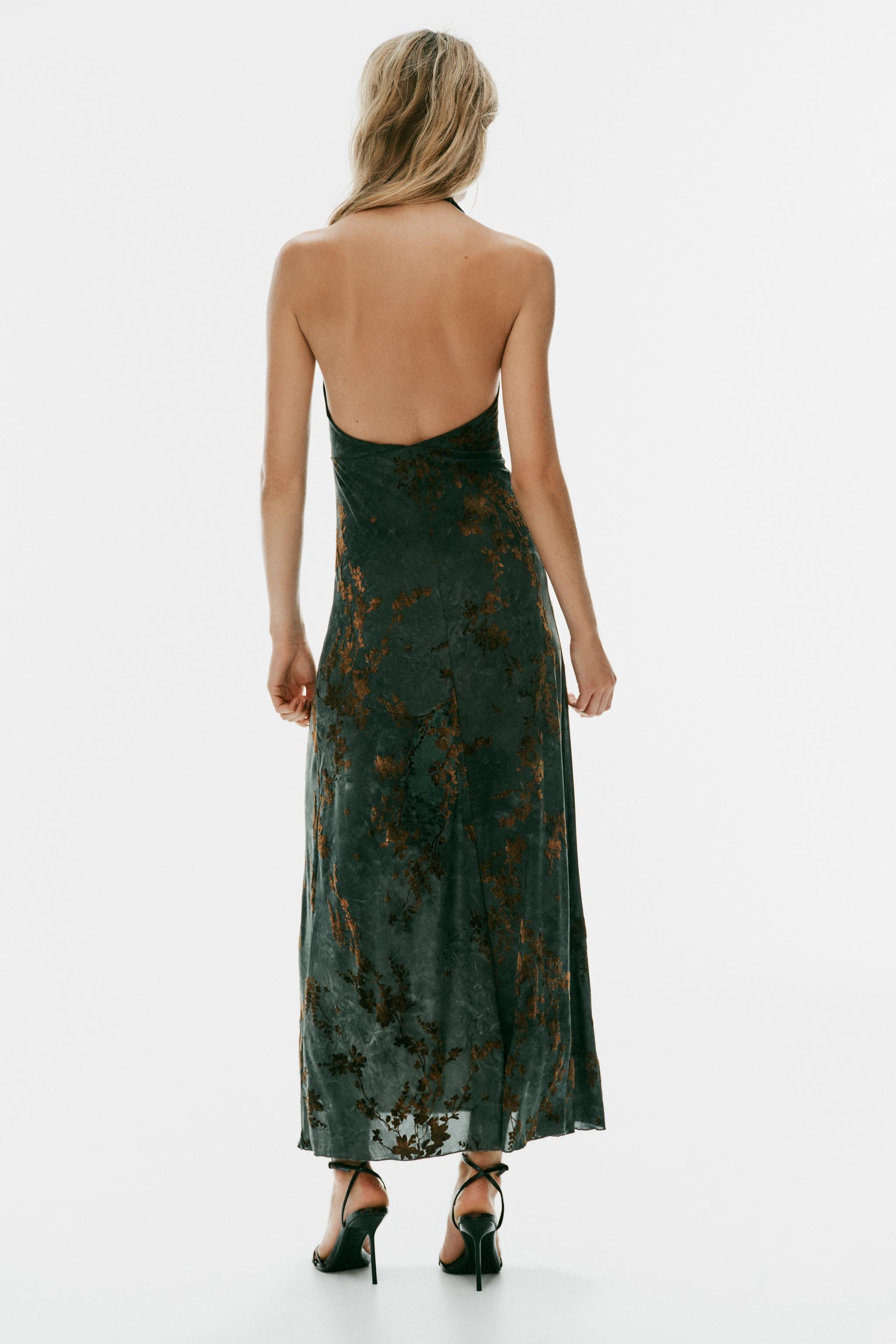 Long dress with a halter neck and V-neckline. Features flocked fabric detail. | Zara US