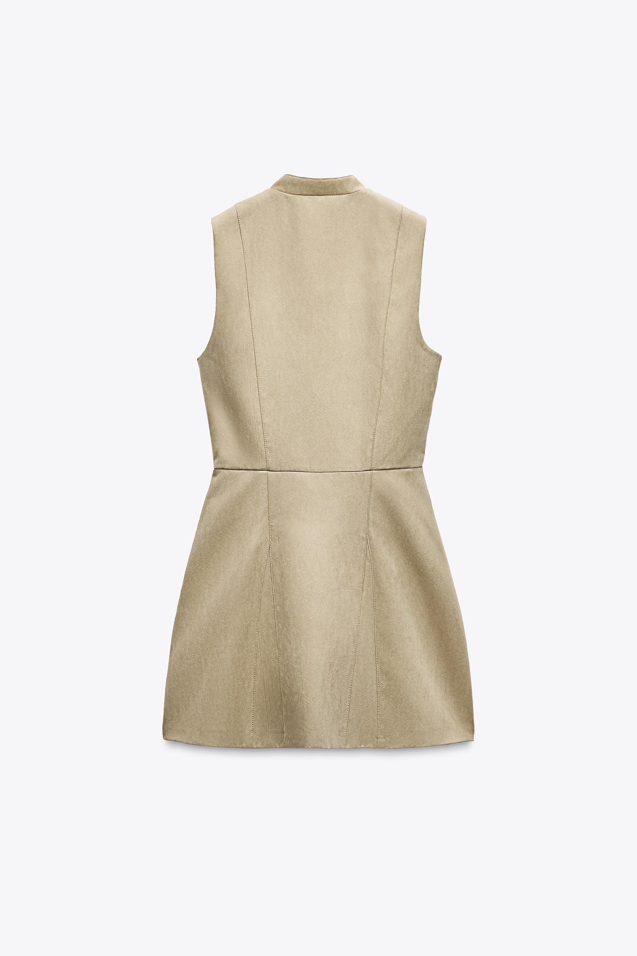 Mock neck sleeveless dress. Front crossover closure with zipper and snap buttons. | Zara US