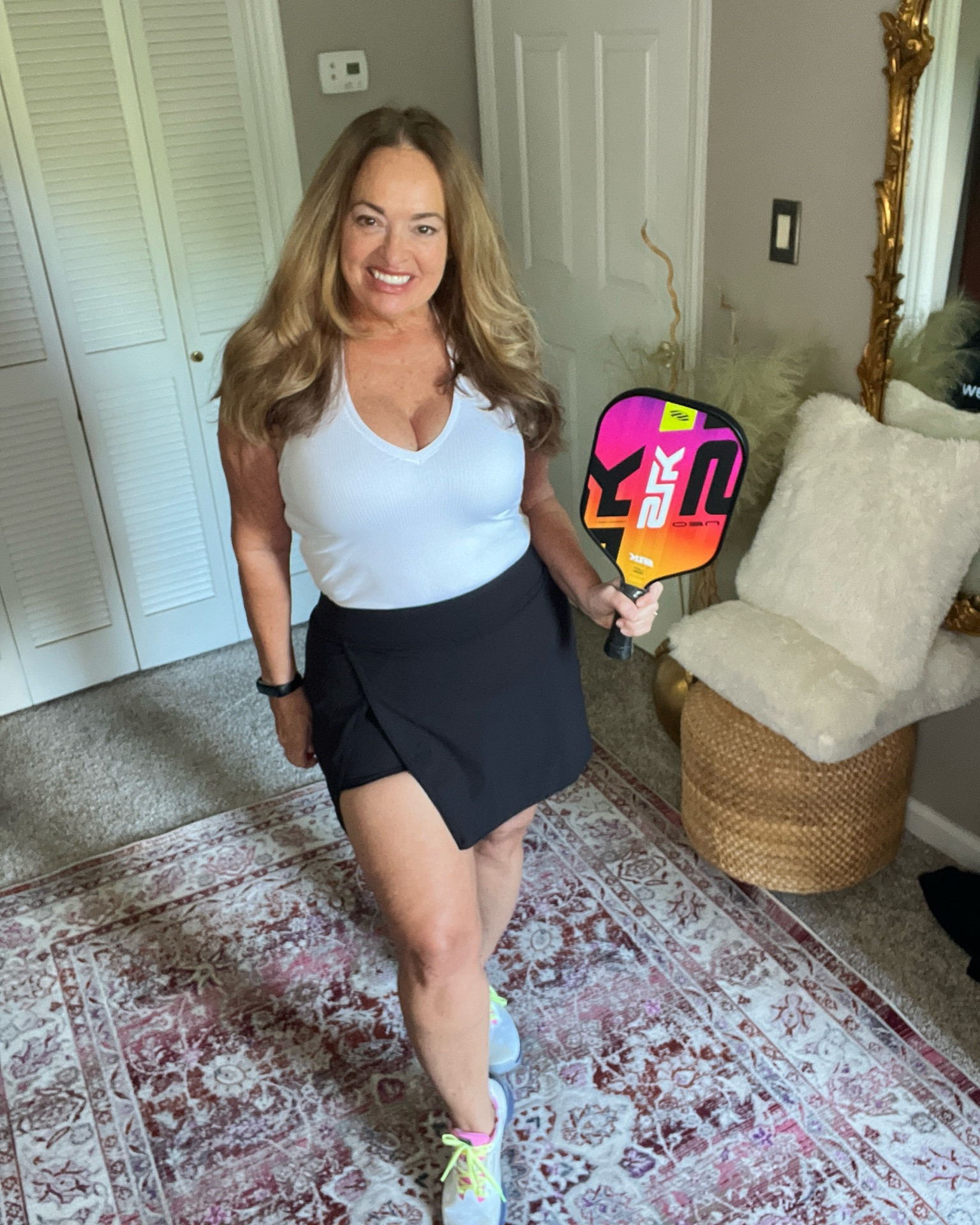 A fabulous design on the athletic skirt 
With a high side slit for movement and a comfortable white halter tee.

#LTKfitnessgoals #LTKTravel #LTKActive