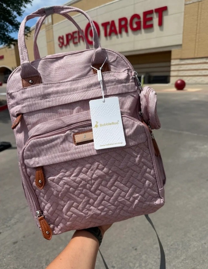 The diaper bag that somehow fits everything without turning into a black hole… plus the baby carrier that saves your back while keeping your little one close? Now available at Target! 🎯