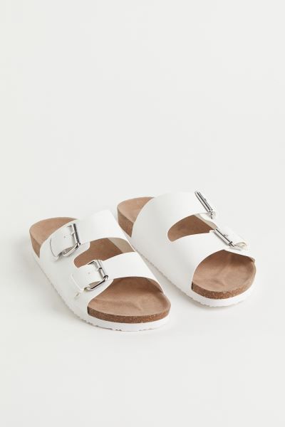 Classic two-strap slides in faux leather. Adjustable foot straps with metal buckles. Molded faux ... | H&M (US + CA)