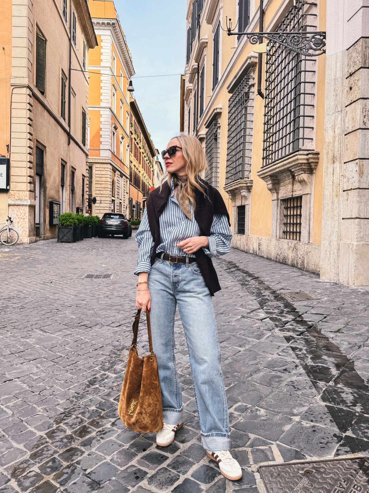 Travel look, @Zara striped shirt, @Levi's cuffed baggy 90’s jeans, Adidas Samba sneakers, suede YSL bucket bag, European vacation, spring break outfit 

#LTKSaleAlert #LTKOver40 #LTKTravel