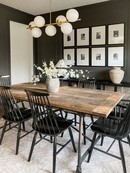 Dining room decor: gallery wall frames, brass chandelier, faux white blossom branches, reclaimed wood dining table, high back slat dining chairs, vases, table lamp, neutral area rug 

#springdecor #potterybarn #target #westelm

#LTKstyletip #LTKFind #LTKhome