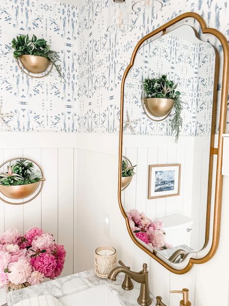 Our gold vanity mirror is on Memorial Day Sale from Wayfair! 

We remodeled this powder room last year with a coastal vibe and love this antique oak bathroom vanity with white Carrara marble top!

Powder room decor, bathroom vanity, 24” vanity, champagne bronze faucet, bathroom sink faucet, herringbone tile, wall mirror, bathroom mirror, Kolher toilet, wall art, hanging wall planter, half bathroom, Turkish hand towel, natural wood thin gallery frame, woven rattan vase, three legged table, white bath rug, woven trash can, waste basket, white ceramic soap dispenser.

#powderroom #bathroom #vanity

#LTKhome #LTKFind #LTKsalealert