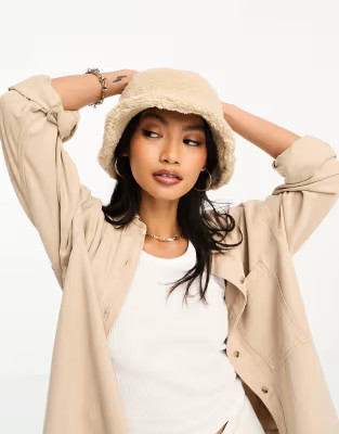 ASOS DESIGN teddy borg bucket hat in cream | ASOS (Global)