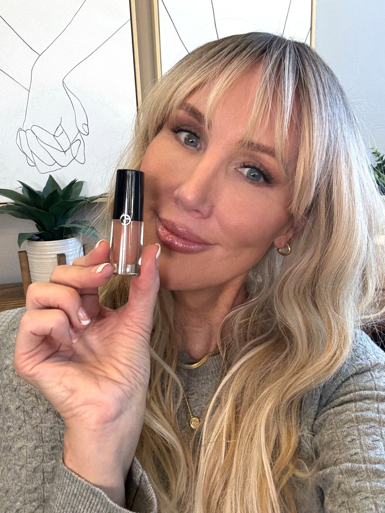 I get asked about this wig all the time. It’s a synthetic wig. Very inexpensive. I trimmed the bangs and dipped the wig in simmering water for four seconds to loosen the curl to a more modern waved look. This made the wig look less like a wig and kore natural. #wig #hair #hairstyle #syntheticwig #longhair #bangs 

#LTKStyleTip #LTKBeauty #LTKOver40