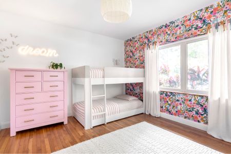 This pretty-in-pink girls' bedroom—a floral-themed paradise includes a cozy bunk bed with fun striped bedding. The walls are adorned with charming floral wallpaper, creating a magical sanctuary where little ones can play, dream, and grow. #girlsbedroom #pinkbedroom #kidsbedroom #floralbedroom #floralgirlsroom #luxuryhome #miamihome #kidsinteriordesign #miamidesign #prettyinpink

#LTKKids #LTKHome