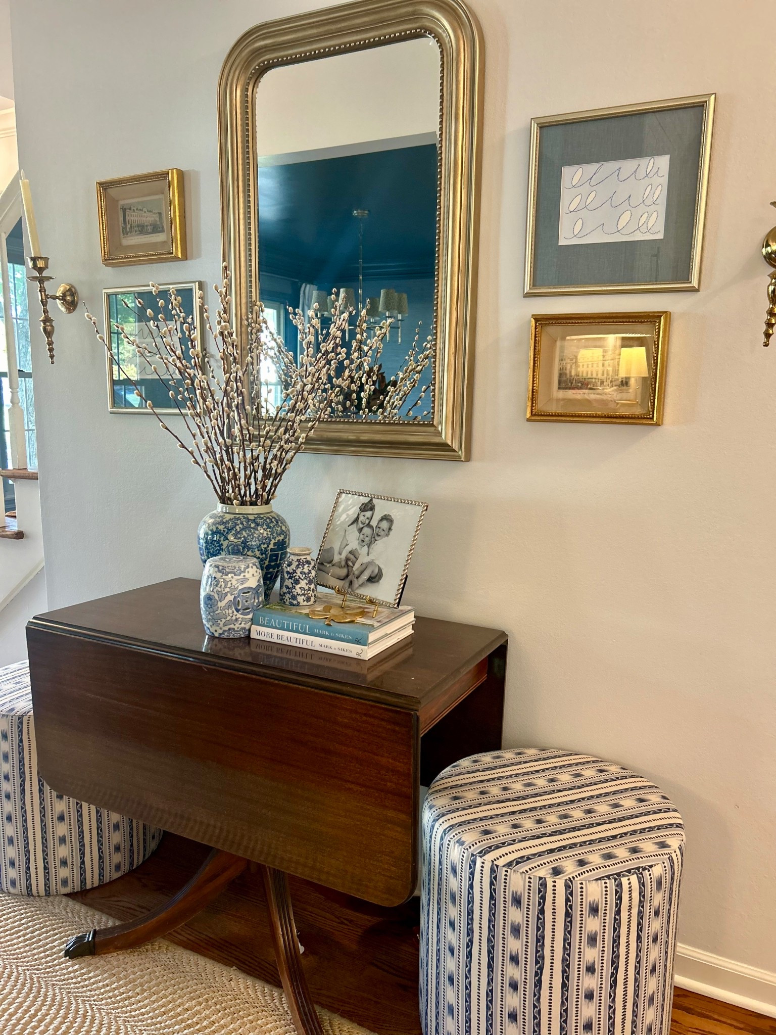 I’m always paying attention to sightlines in a room to create cohesive, yet still interesting spaces. A few guidelines I follow are:
* Carrying the same color palette applied in different ways (60-30-10 color ratio)
* Layering textures
* Mixing metals

These striped blue list ottomans are the perfect and pretty place to sit  

#LTKHome