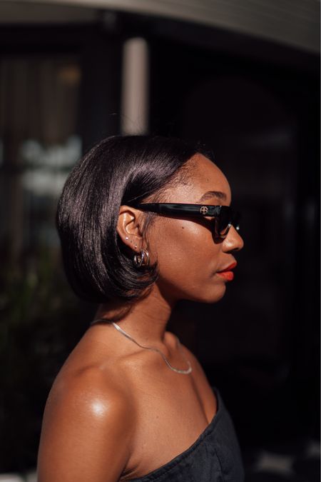 Black sunglasses, gold/silver hoop earrings, herringbone silver necklace, red lipstick 

#LTKStyleTip #LTKBeauty