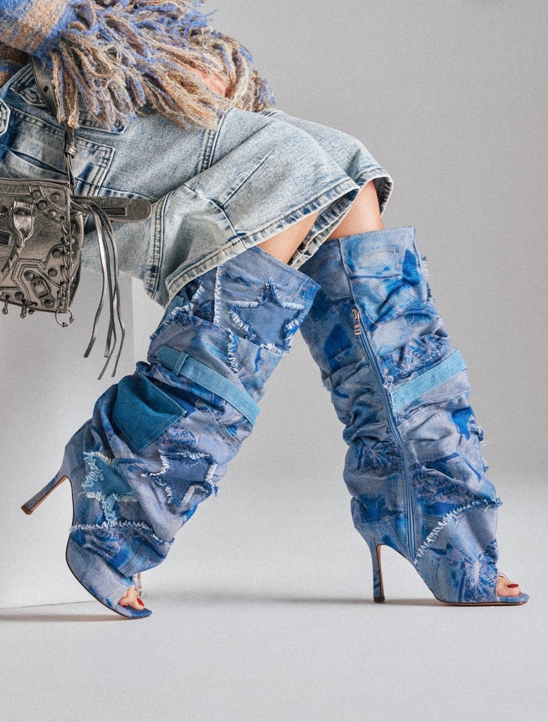 Patchwork denim stiletto boots with a slouchy fit and open toe for bold, street-meets-editorial style. 

#LTKootd